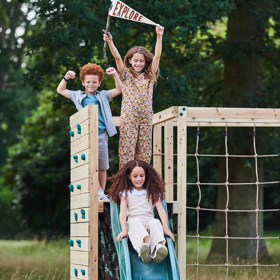 Children playing in Plum Play's Wooden Climbing Cube