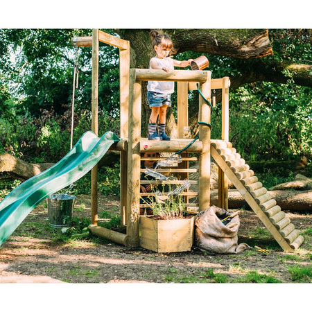 Child watering the plants in Plum Play's Discovery Woodland Treehouse