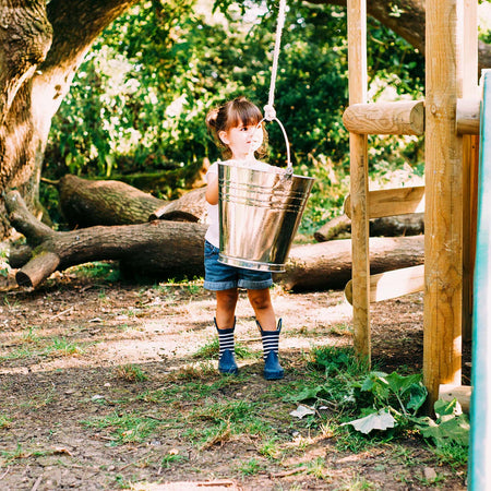 Pail with pulling rope for water play included in Plum Play's Discovery Woodland Treehouse