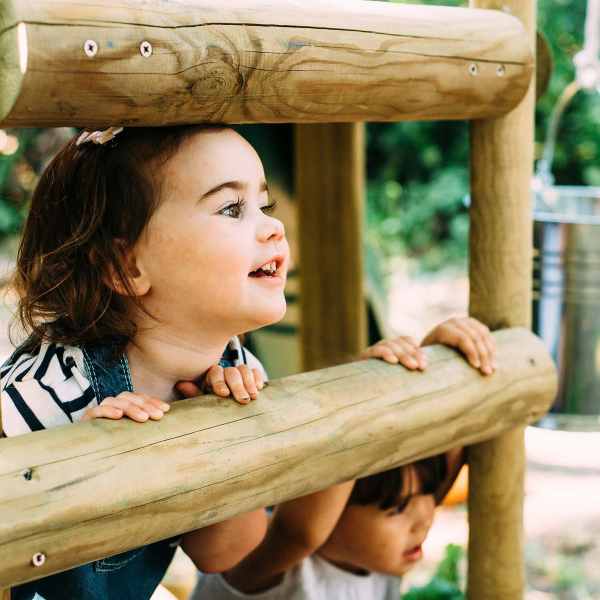 Children happily playing in Plum Discovery Woodland Treehouse