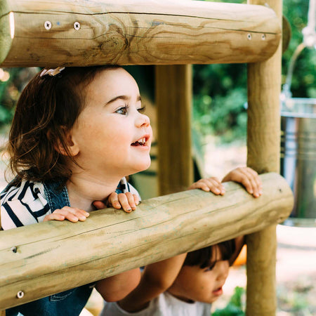 Children happily playing in Plum Discovery Woodland Treehouse